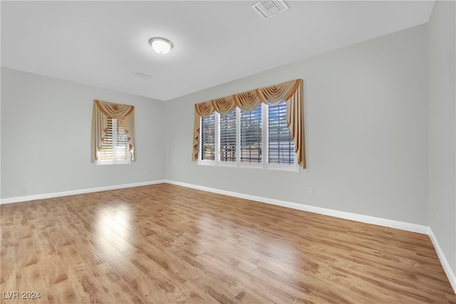 spare room featuring hardwood / wood-style flooring