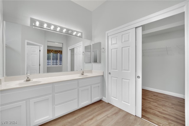 bathroom featuring vanity and wood-type flooring