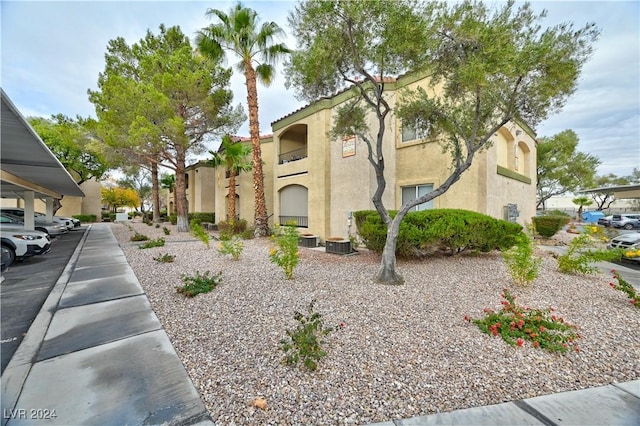 view of side of property featuring central AC unit