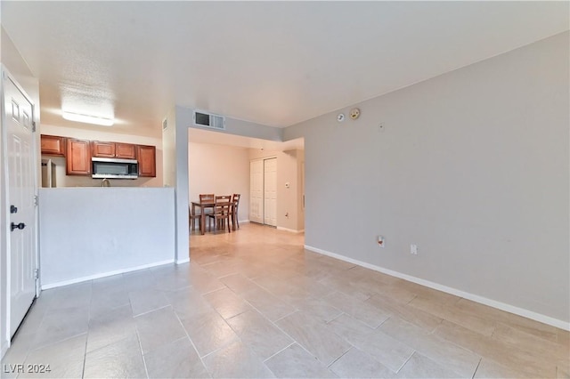 empty room with light tile patterned floors