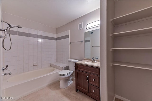 full bathroom with tile patterned floors, vanity, toilet, and tiled shower / bath