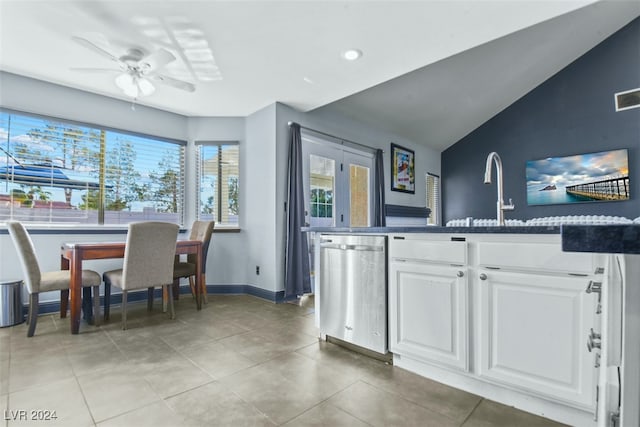 kitchen with white cabinets, dishwasher, a healthy amount of sunlight, and lofted ceiling