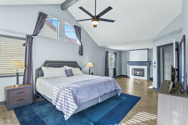 bedroom featuring vaulted ceiling with beams, ceiling fan, and dark hardwood / wood-style flooring