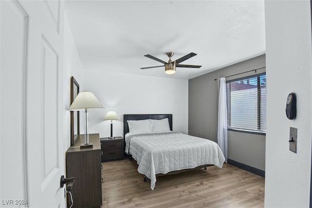 bedroom featuring light hardwood / wood-style flooring and ceiling fan