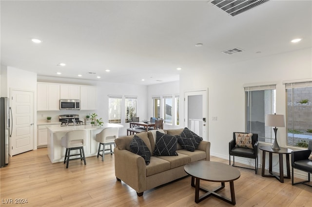 living room with light hardwood / wood-style floors