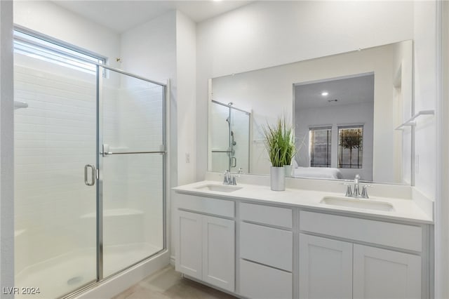 bathroom with vanity and an enclosed shower