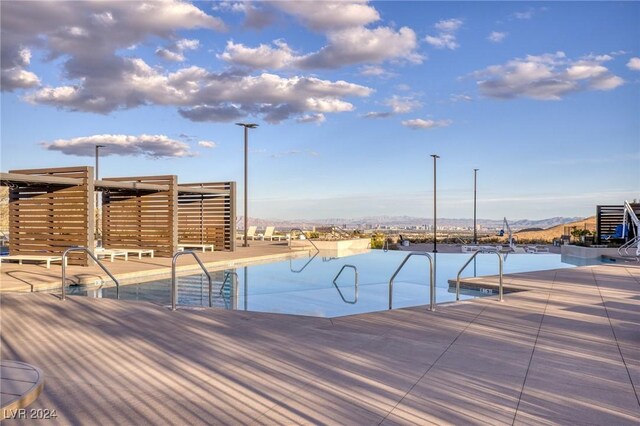 view of pool with a mountain view