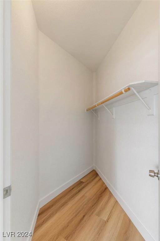 spacious closet with wood finished floors