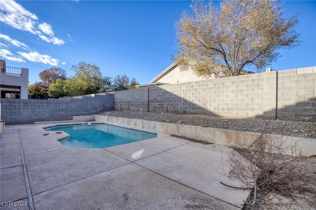 view of swimming pool with a patio, a fenced backyard, and a fenced in pool