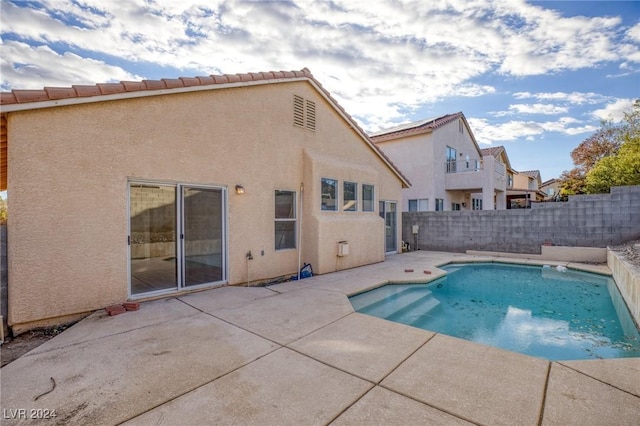 view of swimming pool featuring a patio area, a fenced backyard, and a fenced in pool