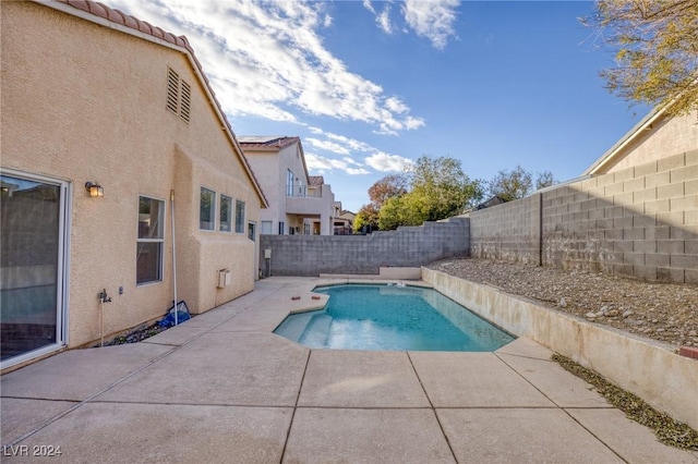 view of swimming pool with a fenced in pool, a fenced backyard, and a patio