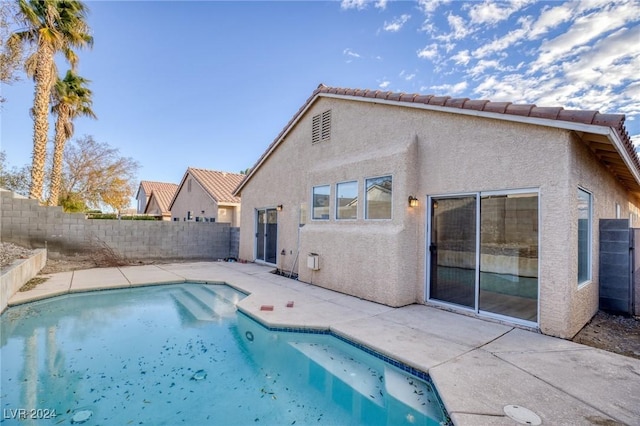 view of swimming pool featuring a patio area and a fenced backyard