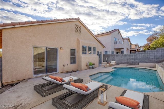 view of swimming pool with a patio, a fenced backyard, and a fenced in pool