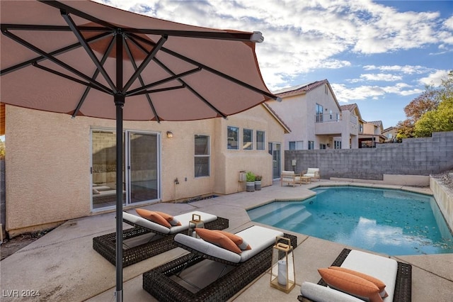 view of pool with a fenced in pool, a patio area, and a fenced backyard