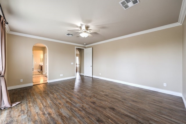 spare room featuring ceiling fan, dark hardwood / wood-style floors, and ornamental molding