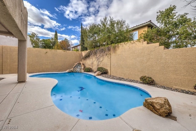 view of swimming pool featuring a patio area