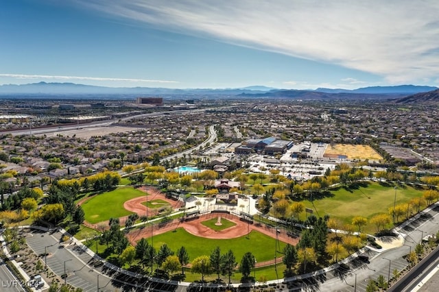 birds eye view of property with a mountain view