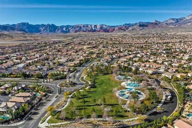 birds eye view of property with a mountain view