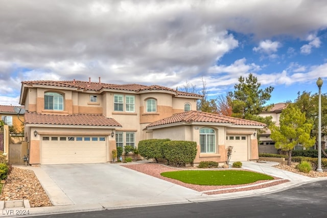 mediterranean / spanish-style house featuring a garage