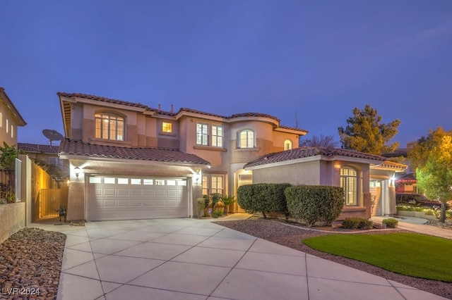 mediterranean / spanish-style home featuring a garage