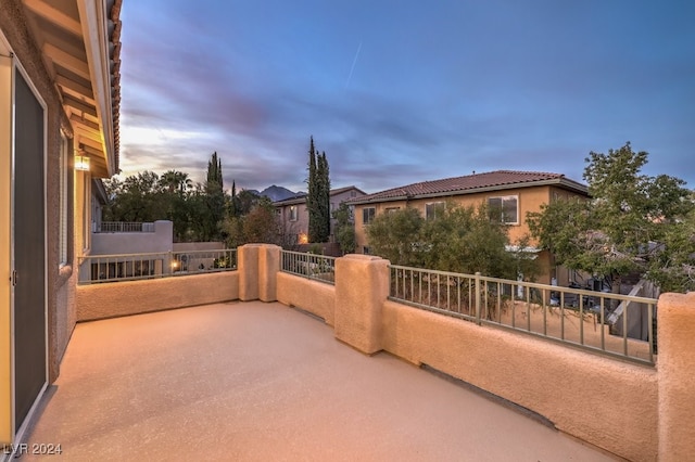 patio terrace at dusk with a balcony