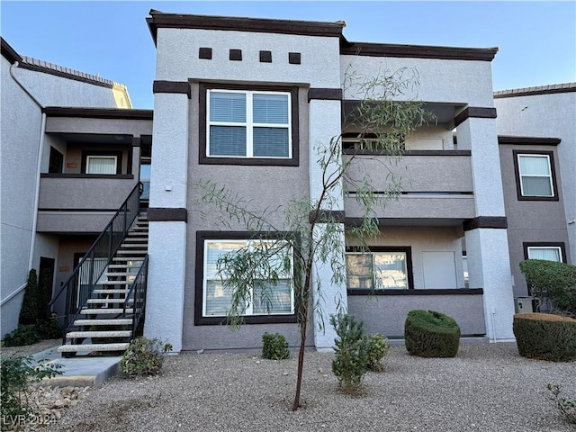 view of front of home with a balcony