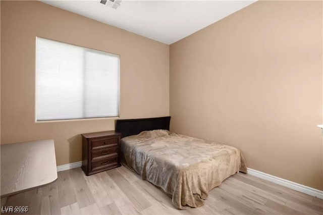 bedroom with light hardwood / wood-style floors