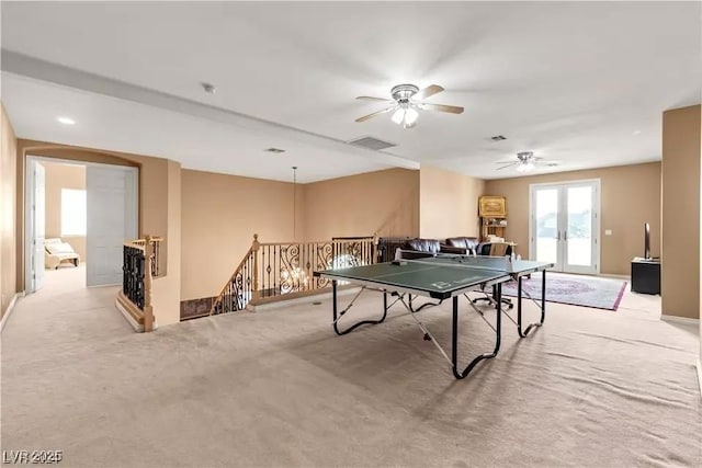 playroom featuring light carpet and french doors