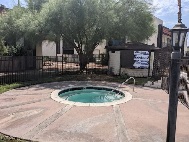 view of pool featuring a hot tub