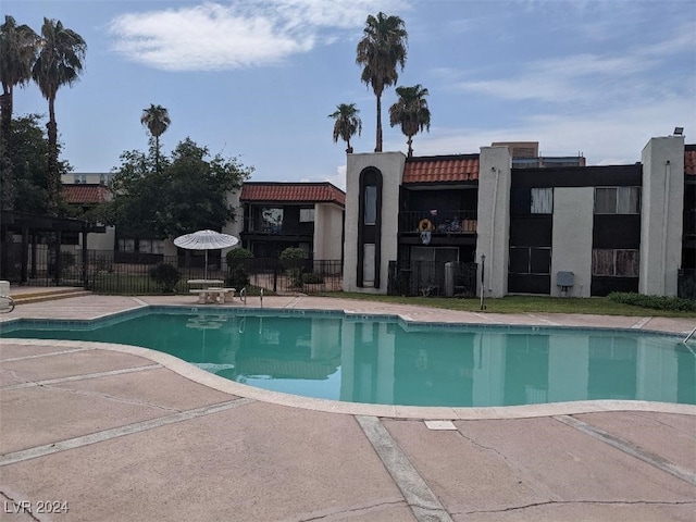 view of swimming pool featuring a patio area