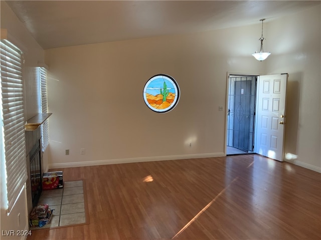 foyer entrance with a fireplace and dark hardwood / wood-style floors