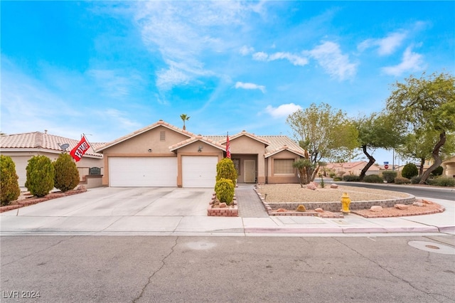 view of front of home with a garage