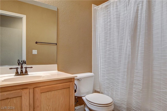 full bathroom with a shower with curtain, a textured wall, vanity, and toilet