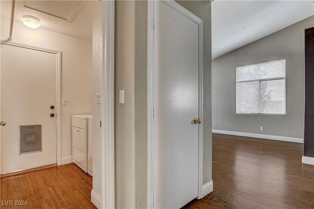 hall with dark wood-type flooring and baseboards