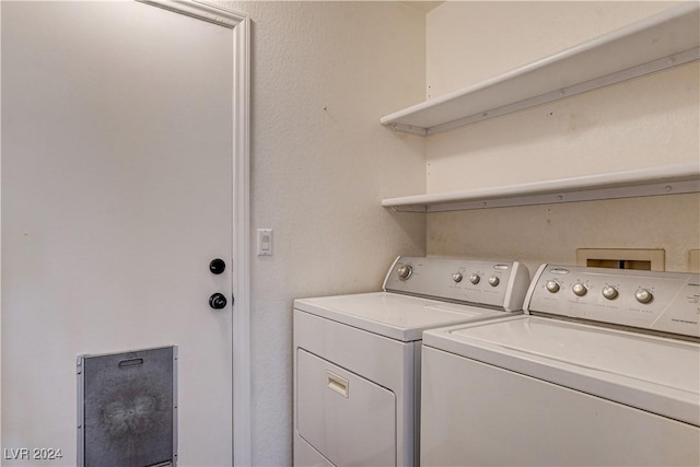 laundry area featuring laundry area and washer and clothes dryer