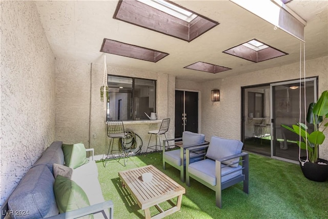 view of patio / terrace with a bar and an outdoor hangout area