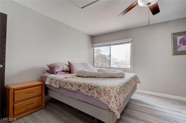 bedroom with ceiling fan and light hardwood / wood-style floors