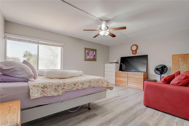 bedroom featuring ceiling fan and light hardwood / wood-style flooring