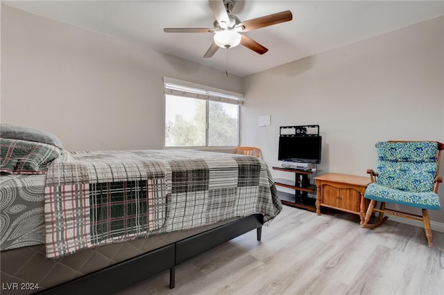 bedroom with ceiling fan and hardwood / wood-style flooring