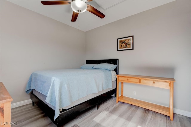 bedroom with ceiling fan and hardwood / wood-style floors