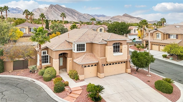 view of front of house featuring a mountain view and a garage