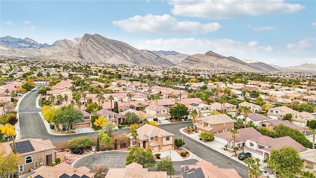 birds eye view of property featuring a mountain view