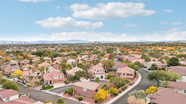 birds eye view of property featuring a mountain view