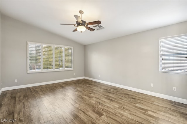 spare room featuring hardwood / wood-style floors, ceiling fan, and lofted ceiling