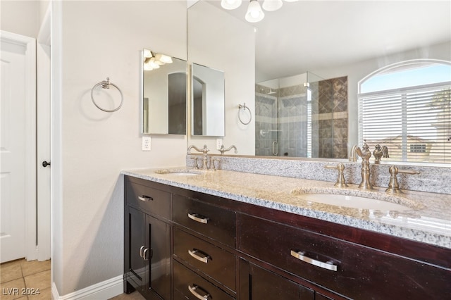 bathroom with vanity, tile patterned floors, and walk in shower