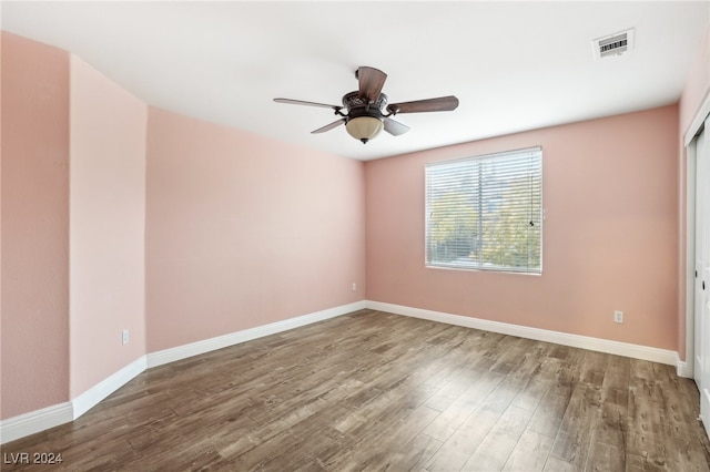 unfurnished room with hardwood / wood-style flooring and ceiling fan