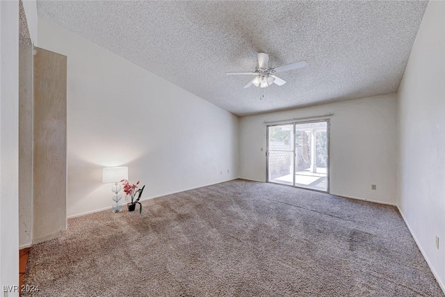 carpeted empty room with a textured ceiling and ceiling fan