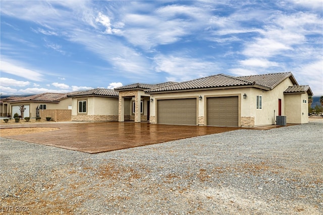 mediterranean / spanish-style home featuring a garage