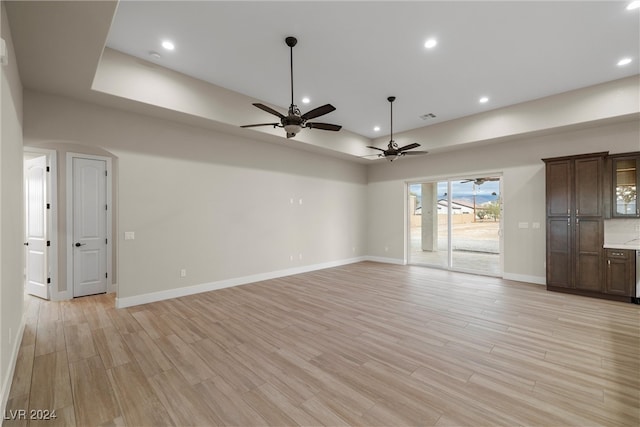 unfurnished room featuring light hardwood / wood-style flooring and ceiling fan