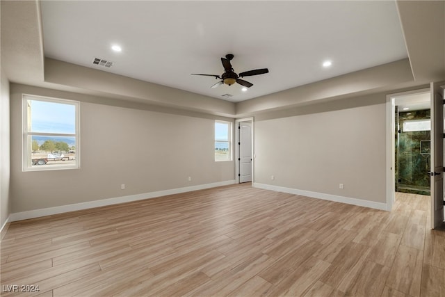 unfurnished room with light wood-type flooring and ceiling fan